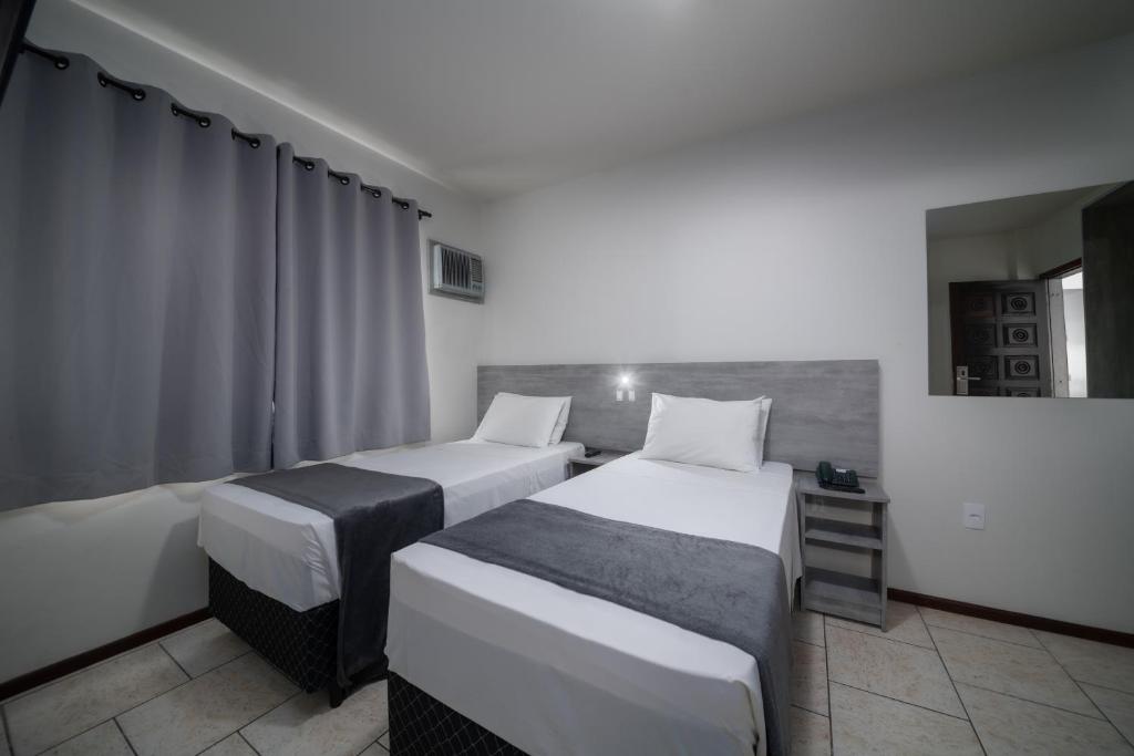 Postel nebo postele na pokoji v ubytování Lumar Hotel