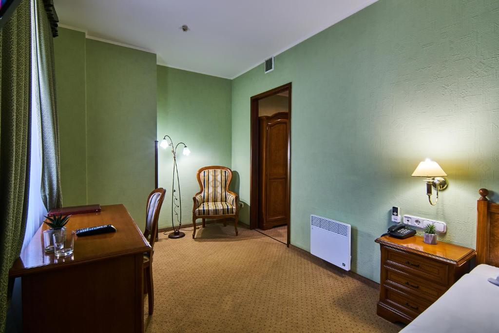 Postel nebo postele na pokoji v ubytování Art Hotel Academy