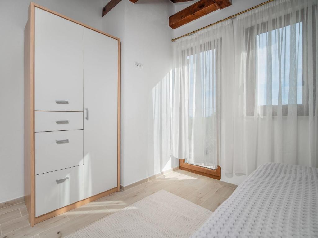 Postel nebo postele na pokoji v ubytování Holiday Home Marko by Interhome
