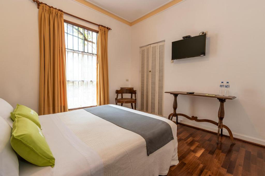 Postel nebo postele na pokoji v ubytování El Patio Miraflores