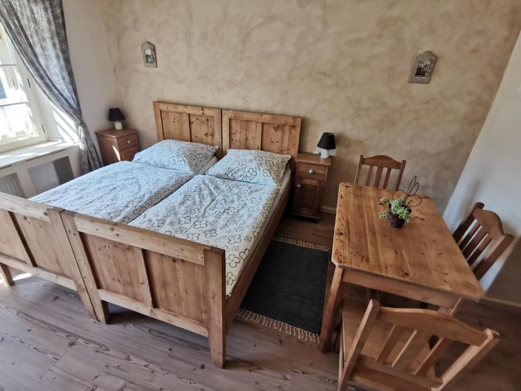 Postel nebo postele na pokoji v ubytování Apartmány U Koudelníka
