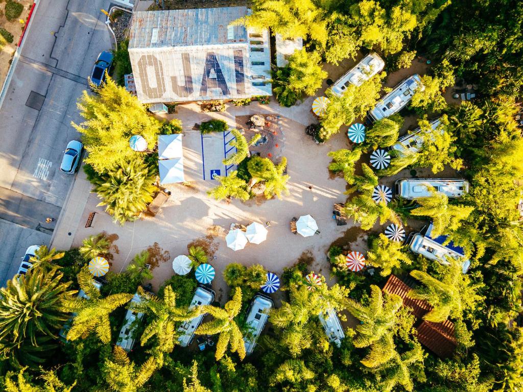 an overhead view of a parking lot with cars and trees at Caravan Outpost in Ojai