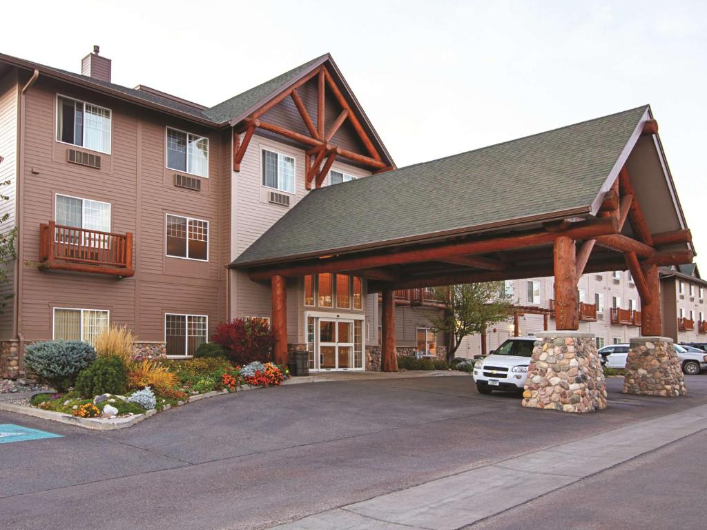 a house with a car parked in front of it at Best Western Plus Riverfront Hotel and Suites in Great Falls