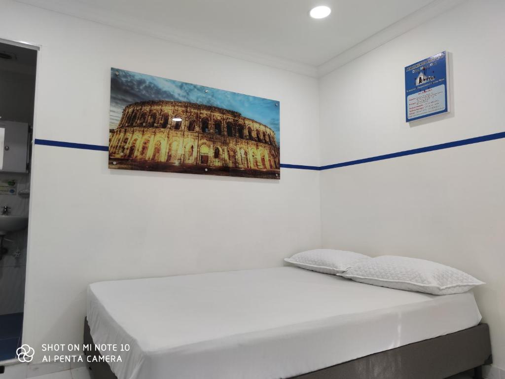 Postel nebo postele na pokoji v ubytování Casa Hotel Manco Mora
