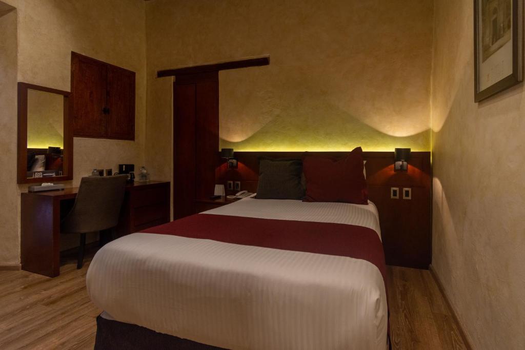 Postel nebo postele na pokoji v ubytování Hotel Madero
