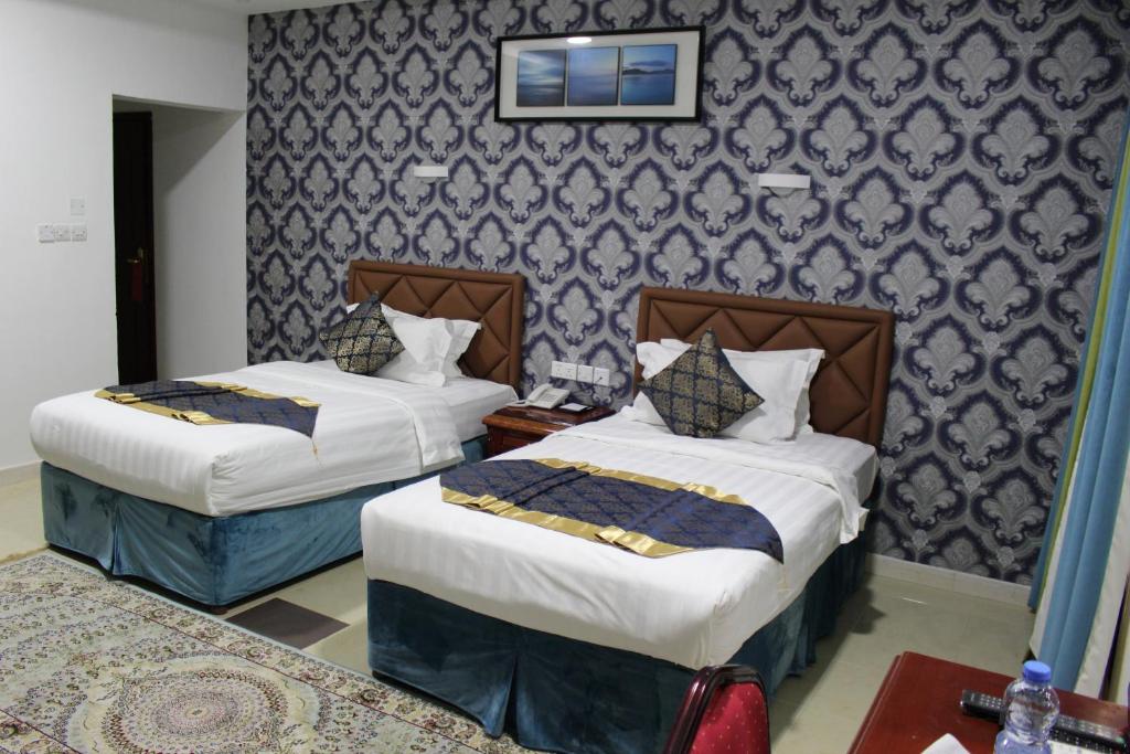 Postel nebo postele na pokoji v ubytování Al Diyar Hotel