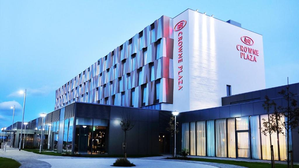 a building with a sign on the side of it at Crowne Plaza Aberdeen Airport by IHG in Dyce