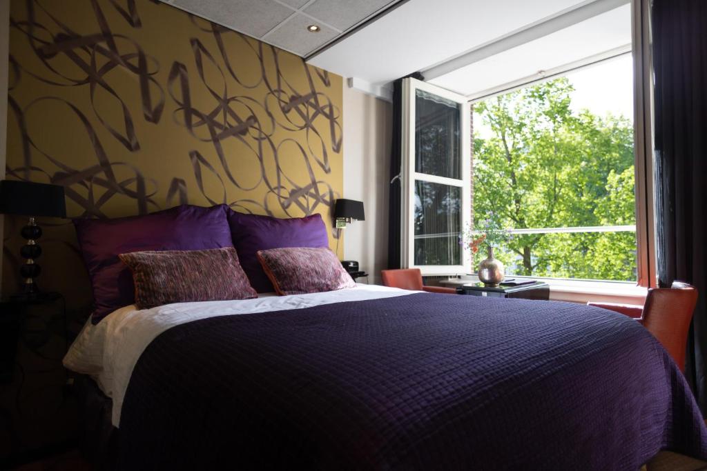 Postel nebo postele na pokoji v ubytování Hotel Sebastians