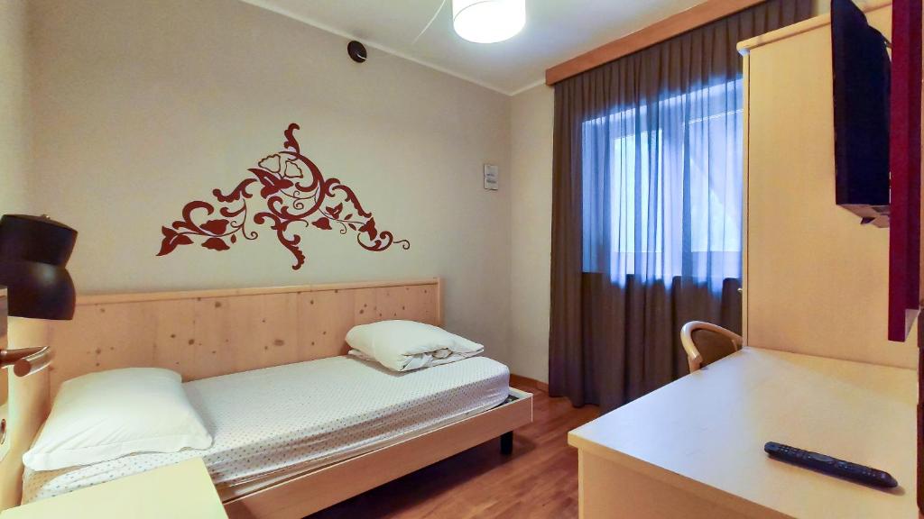 Postel nebo postele na pokoji v ubytování Hotel Principe Marmolada