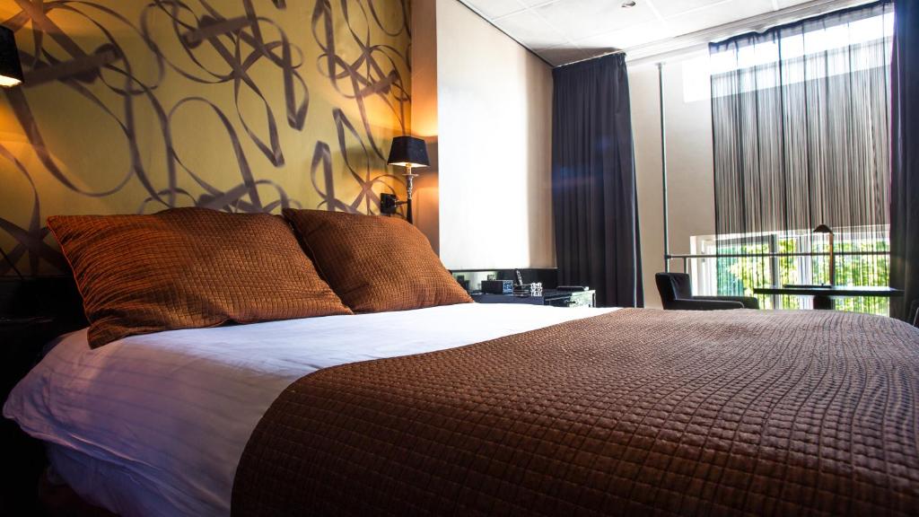 Postel nebo postele na pokoji v ubytování Hotel Sebastians