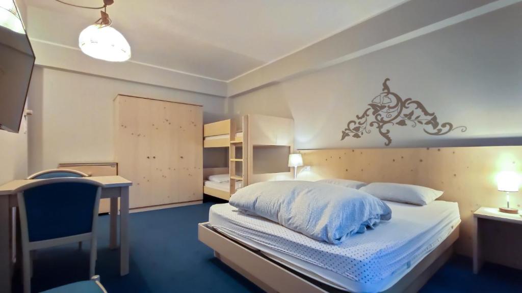 Postel nebo postele na pokoji v ubytování Hotel Principe Marmolada