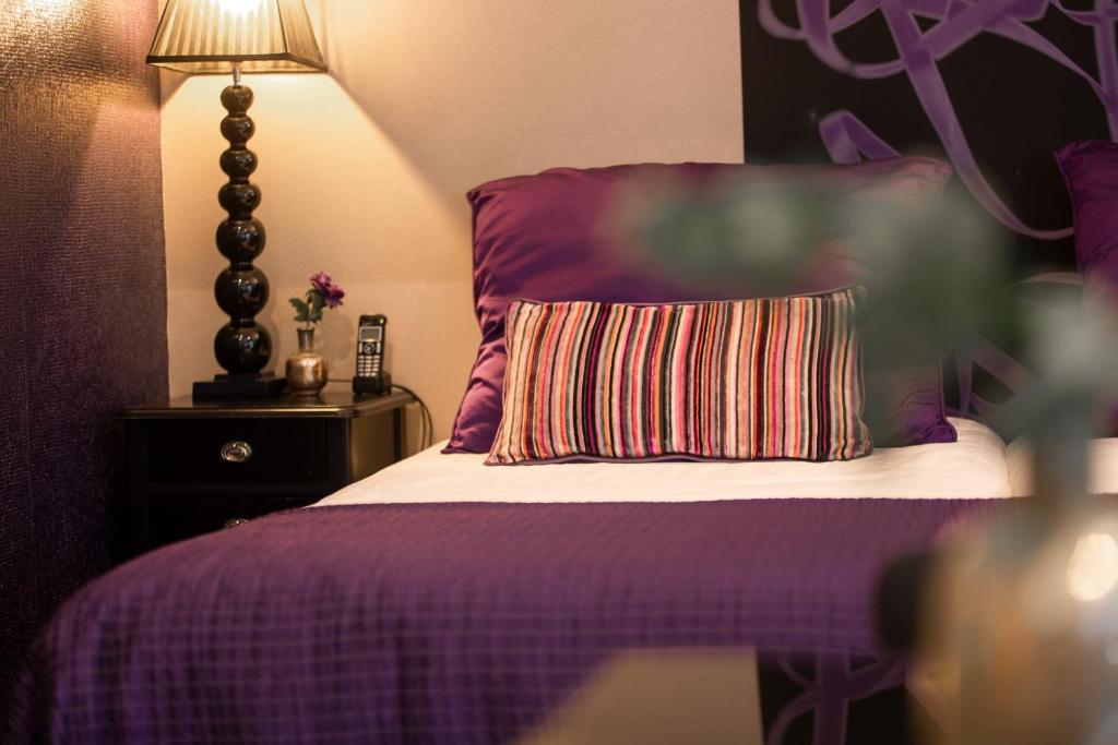 Postel nebo postele na pokoji v ubytování Hotel Sebastians