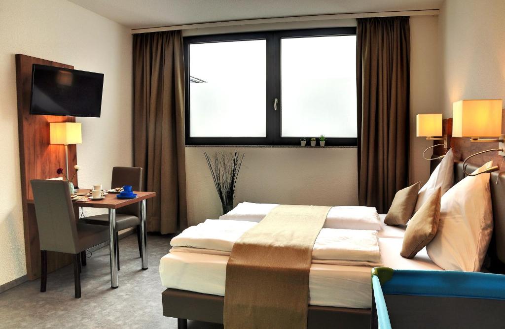 TV a/nebo společenská místnost v ubytování Motel am Fürfelder Schloss