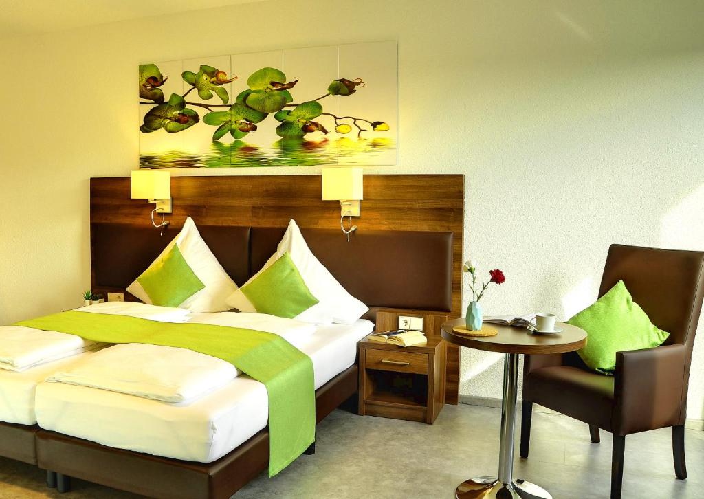 Postel nebo postele na pokoji v ubytování Motel am Fürfelder Schloss