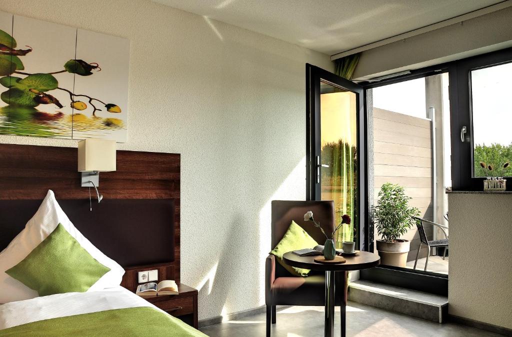 Postel nebo postele na pokoji v ubytování Motel am Fürfelder Schloss
