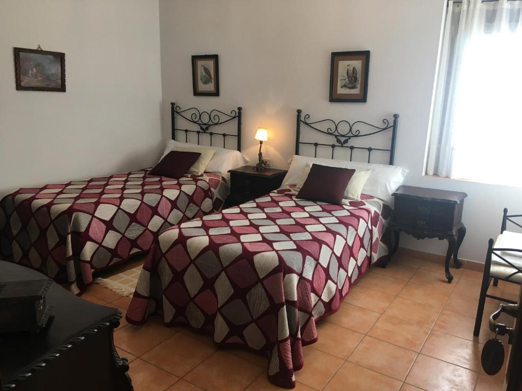 A bed or beds in a room at Casa Palacio Carvajal