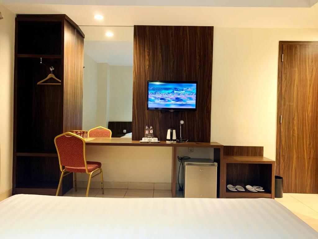 TV a/nebo společenská místnost v ubytování Ameera Hotel
