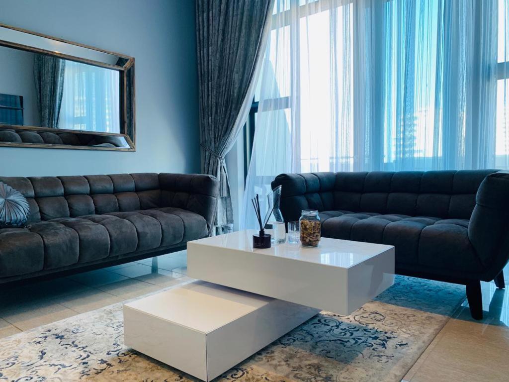 a living room with a couch and a coffee table at The Pearls Independent Umhlanga - Durban in Durban