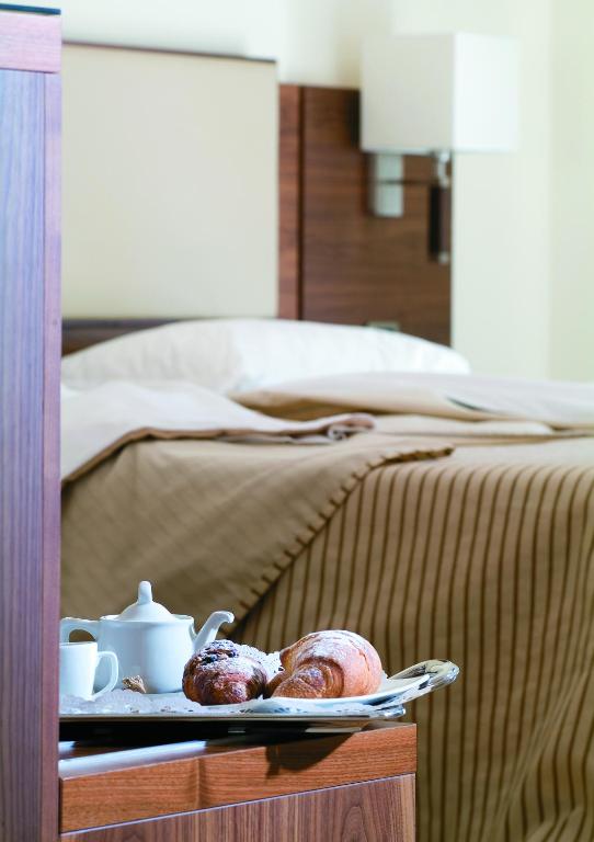 Postel nebo postele na pokoji v ubytování Suites & Residence Hotel