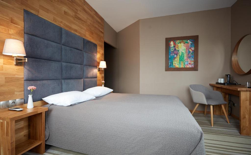 Postel nebo postele na pokoji v ubytování Hotel Batory
