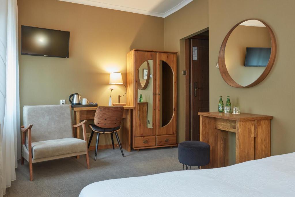Postel nebo postele na pokoji v ubytování Hotel Batory