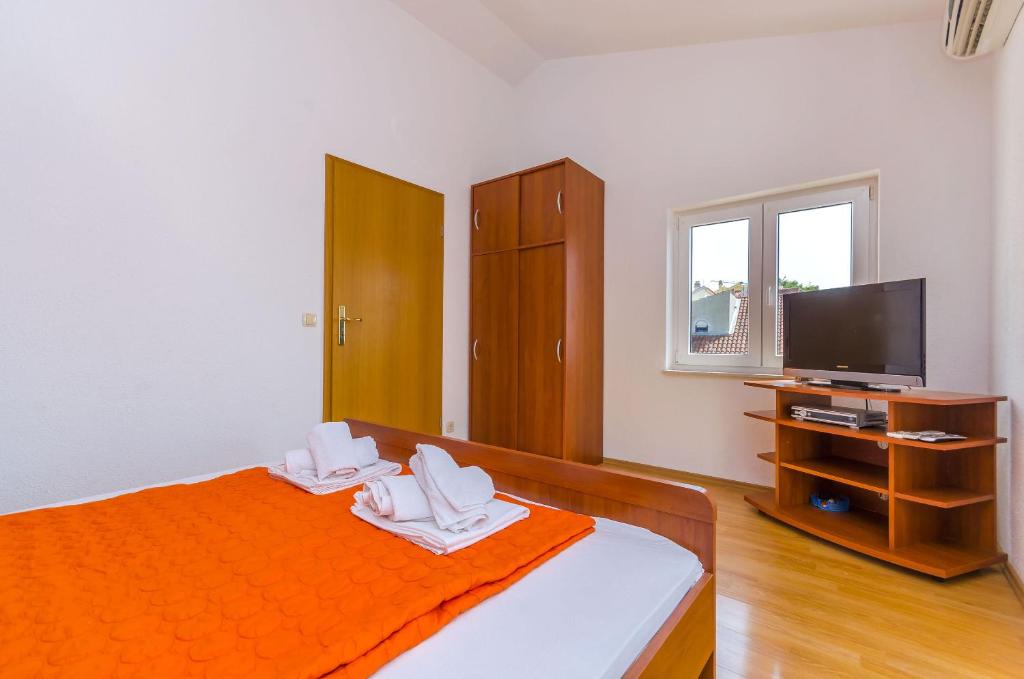 Postel nebo postele na pokoji v ubytování Apartments Tily