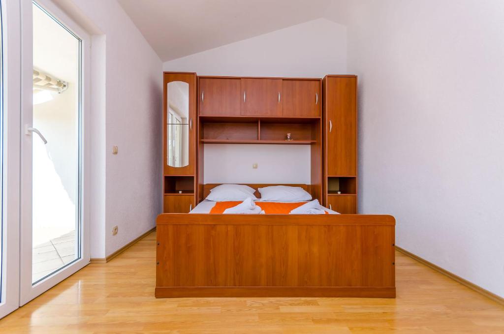 Postel nebo postele na pokoji v ubytování Apartments Tily