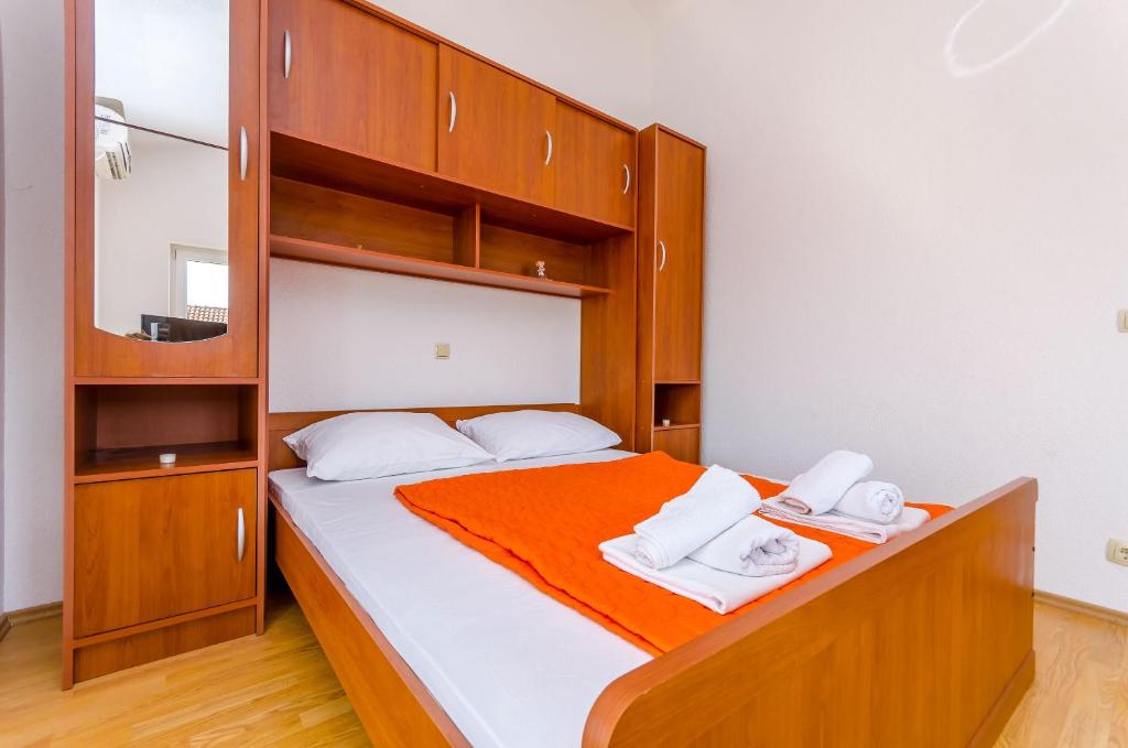 Postel nebo postele na pokoji v ubytování Apartments Tily