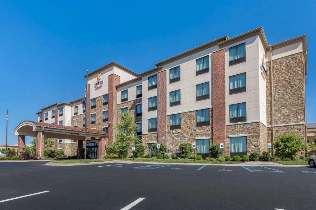 a hotel with a parking lot in front of it at Comfort Suites Bridgeport - Clarksburg in Bridgeport