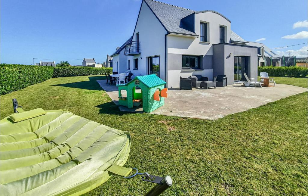 a house with a playground in front of it at Stunning Home In Plouguerneau With 4 Bedrooms And Wifi in Plouguerneau