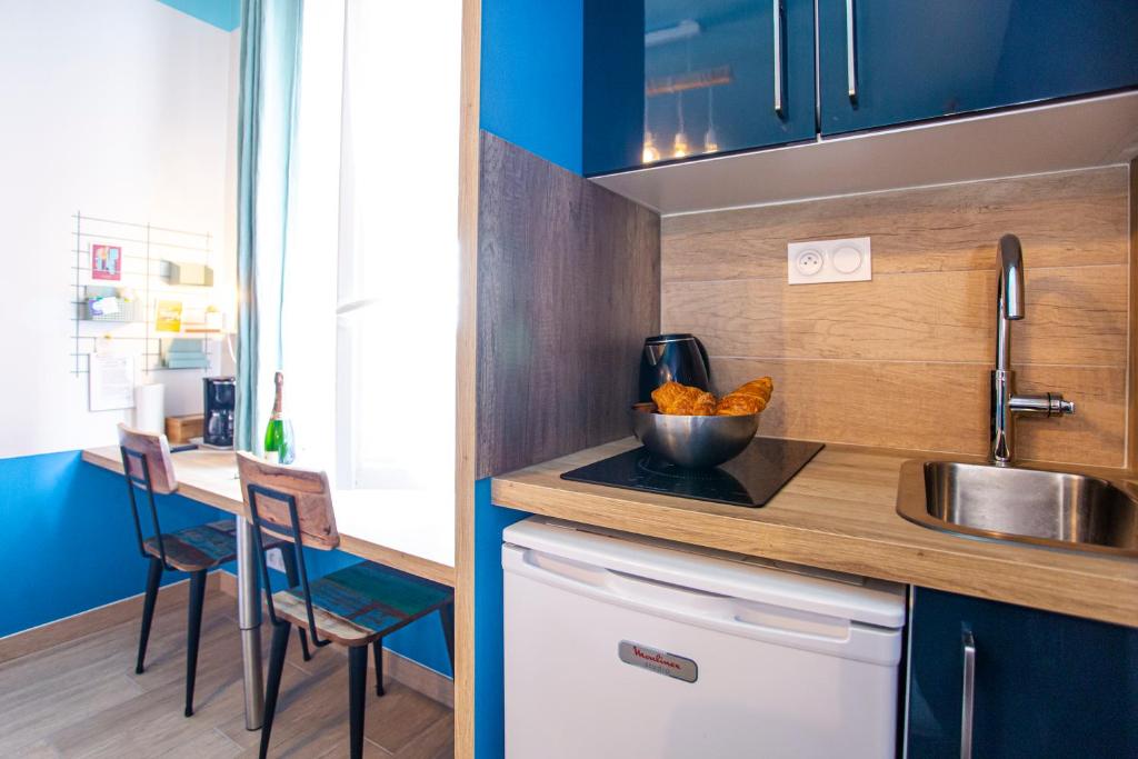 Kuchyň nebo kuchyňský kout v ubytování SMILE APPARTS - Appartements - Au coeur de Lorient - Au calme - Tout Confort