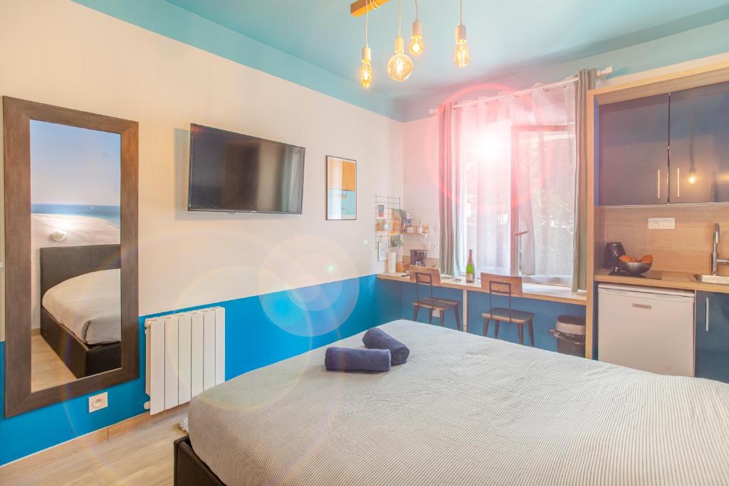 Postel nebo postele na pokoji v ubytování SMILE APPARTS - Appartements - Au coeur de Lorient - Au calme - Tout Confort