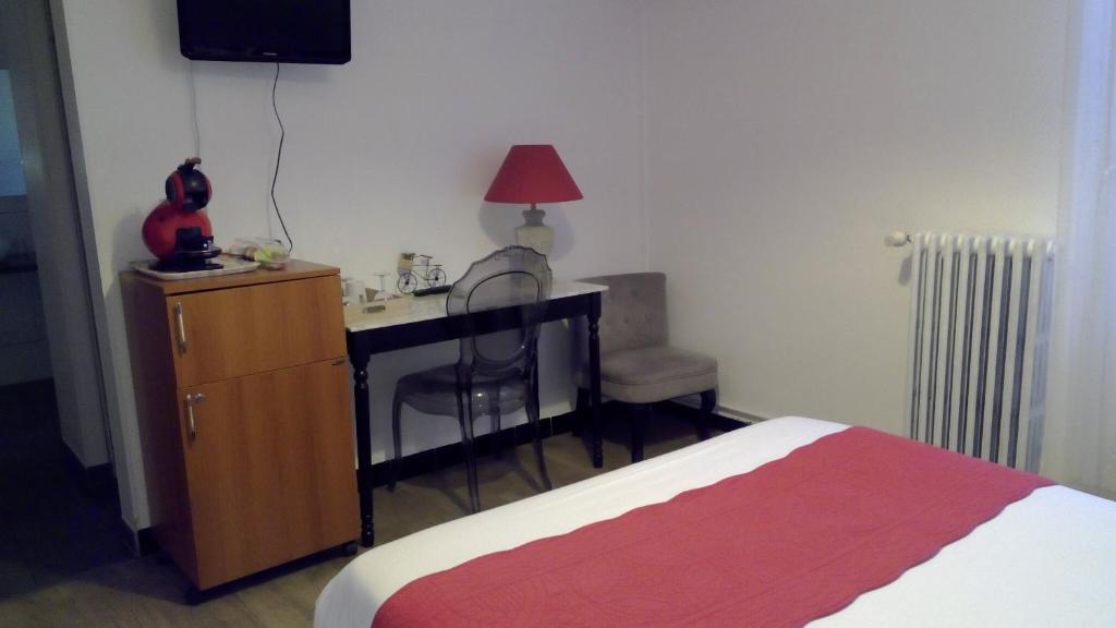 Postel nebo postele na pokoji v ubytování Hotel De La Bastide