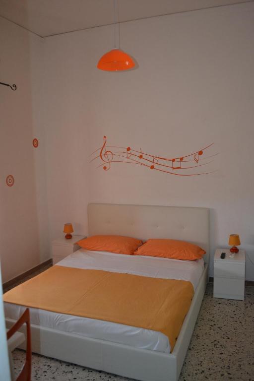 Postel nebo postele na pokoji v ubytování Sorrento Experience