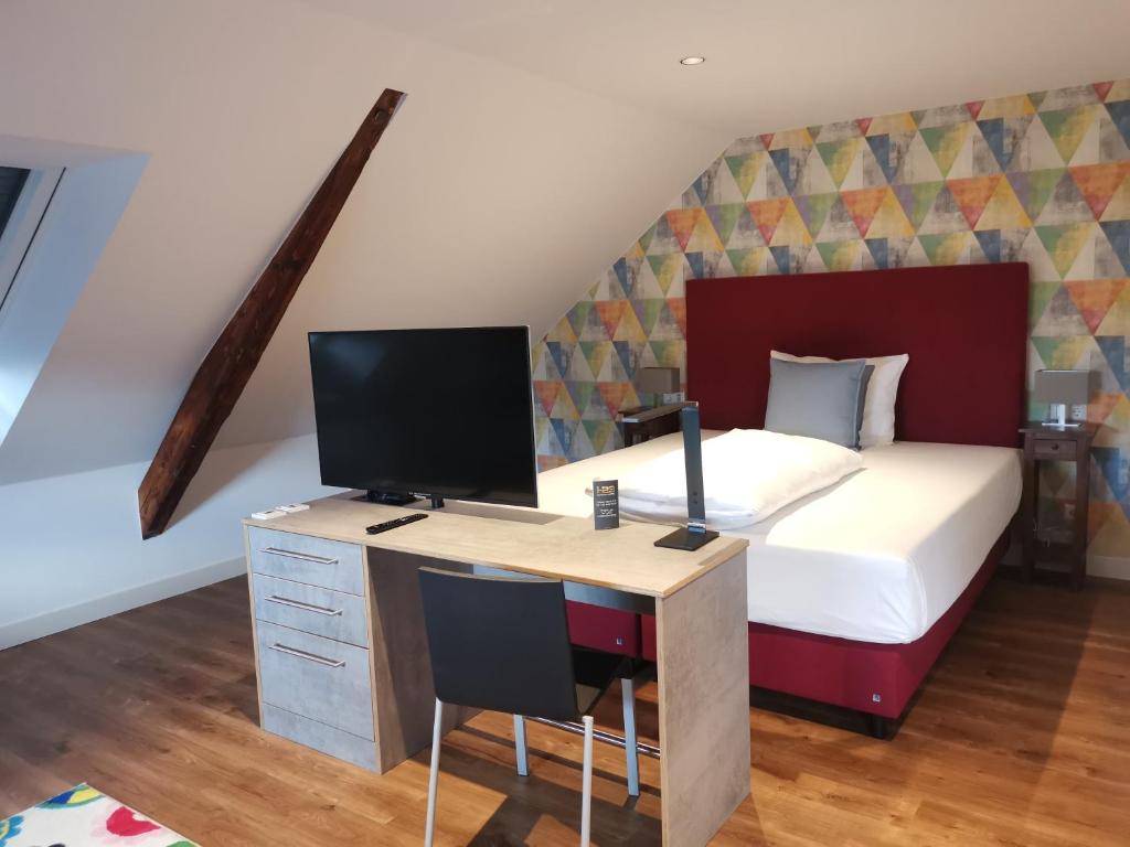 Postel nebo postele na pokoji v ubytování H23 Hotel Stuttgart
