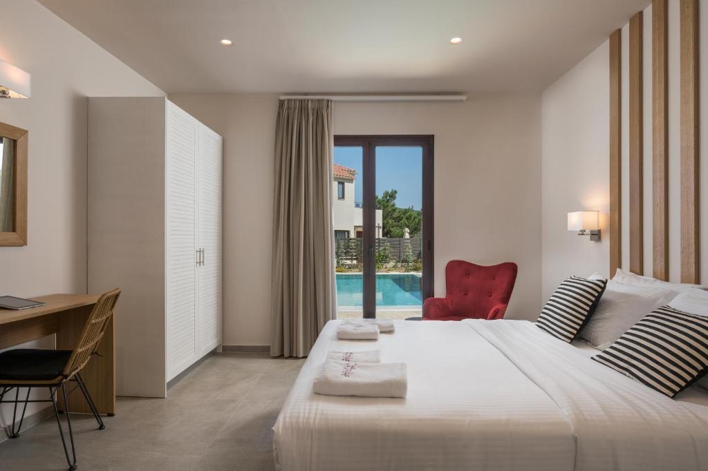 Posteľ alebo postele v izbe v ubytovaní Spilia Village Hotel & Villas