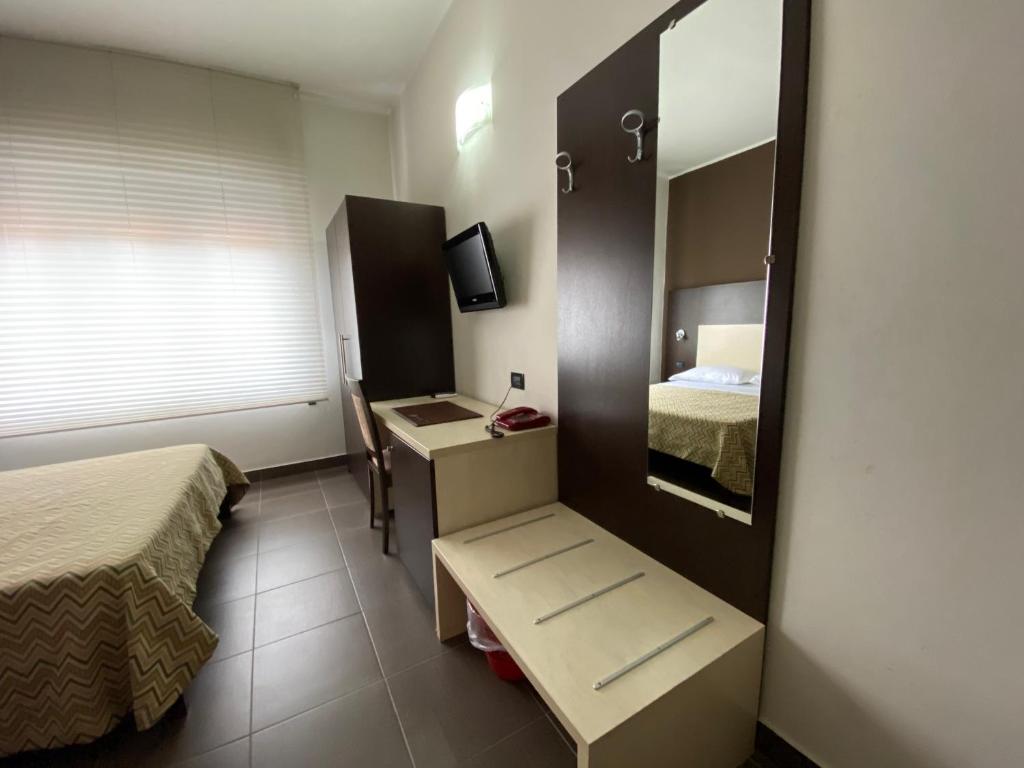 Postel nebo postele na pokoji v ubytování Pansini Hotel Residence