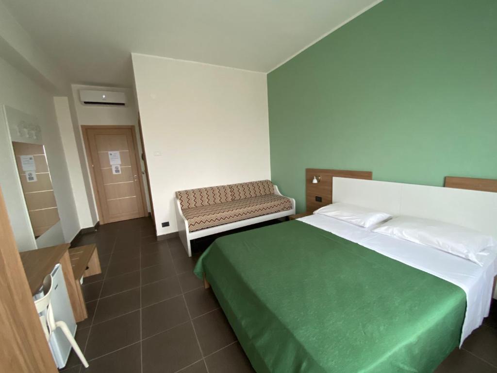 Postel nebo postele na pokoji v ubytování Pansini Hotel Residence