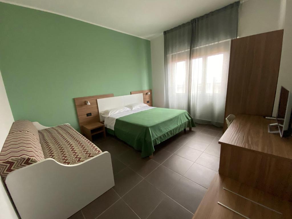 Postel nebo postele na pokoji v ubytování Pansini Hotel Residence