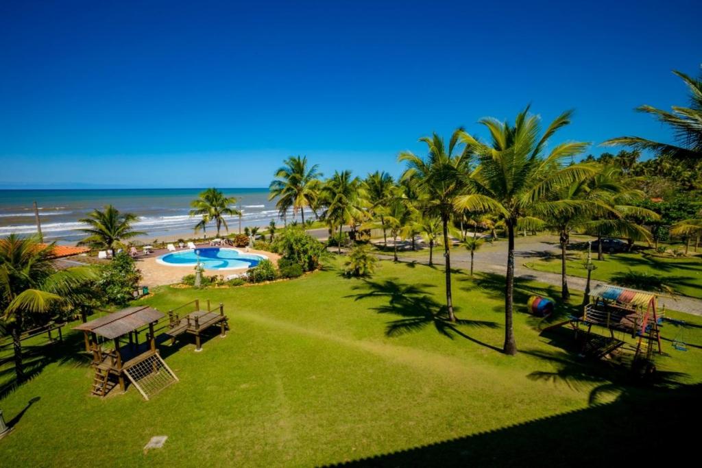 a view of the beach from the balcony of a resort at Pousada do Mar in Ilhéus