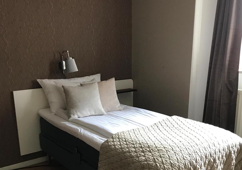Postel nebo postele na pokoji v ubytování Hotell Ronja