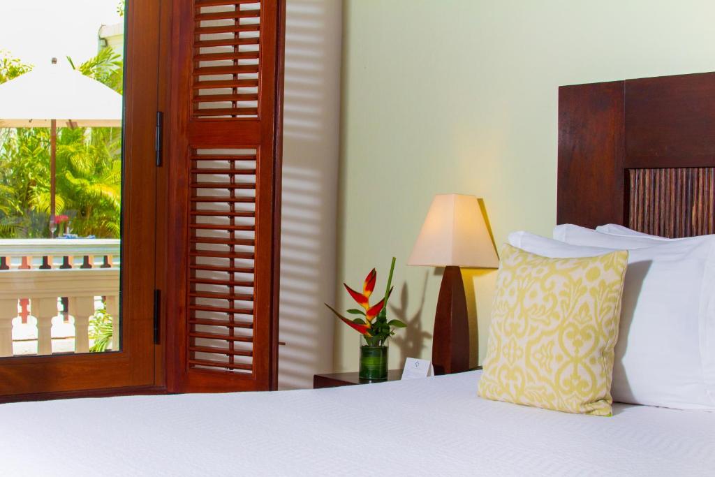 Postel nebo postele na pokoji v ubytování Hotel Quadrifolio