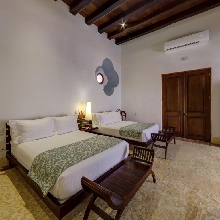 Postel nebo postele na pokoji v ubytování Hotel Quadrifolio