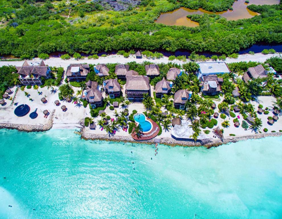 an aerial view of a resort on the beach at Hotel Villas Flamingos in Holbox Island