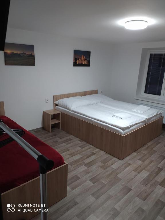 Postel nebo postele na pokoji v ubytování Apartmán u Davida