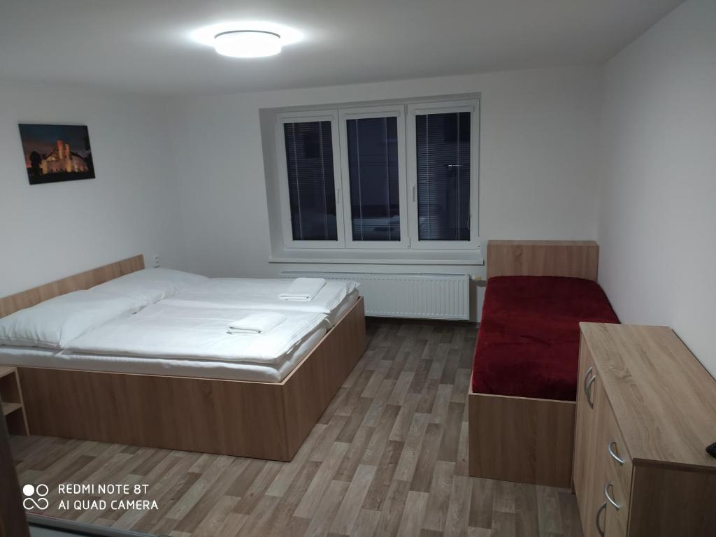 Postel nebo postele na pokoji v ubytování Apartmán u Davida