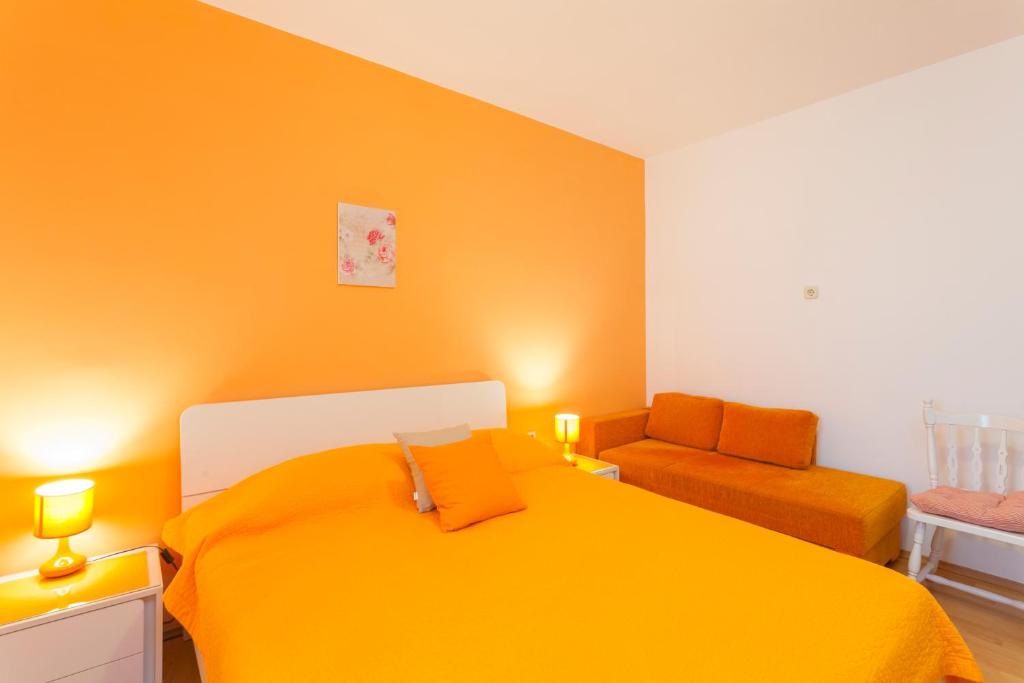 Postel nebo postele na pokoji v ubytování Apartments & Rooms Alagić