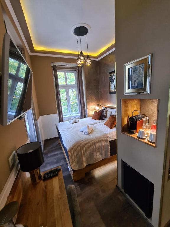 Postel nebo postele na pokoji v ubytování Urban Boutique Hotel