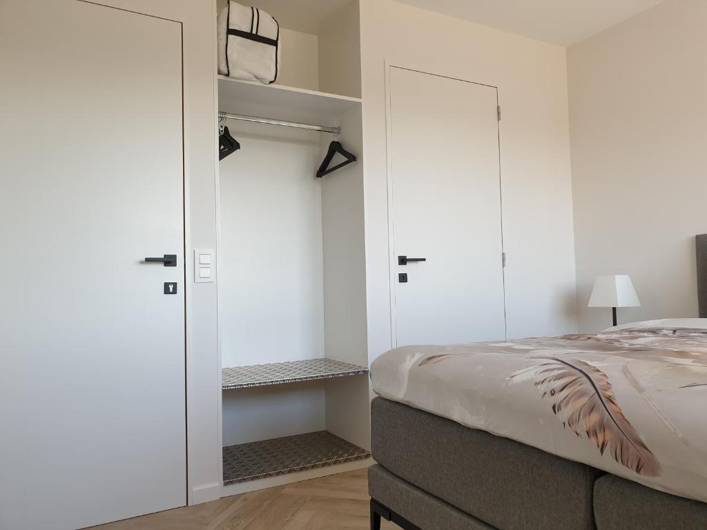 Postel nebo postele na pokoji v ubytování Snooze