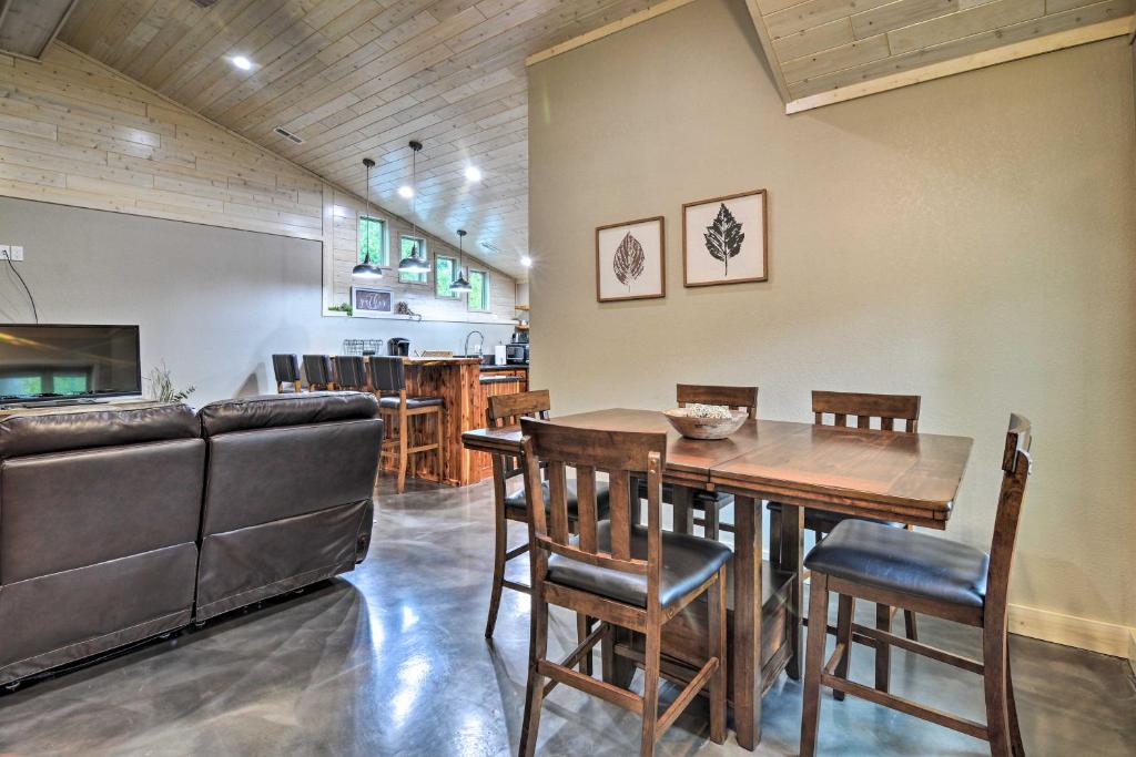 a kitchen and dining room with a table and chairs at Modern Arcadia Farmhouse on 80 Acres - Near Beach! in Arcadia